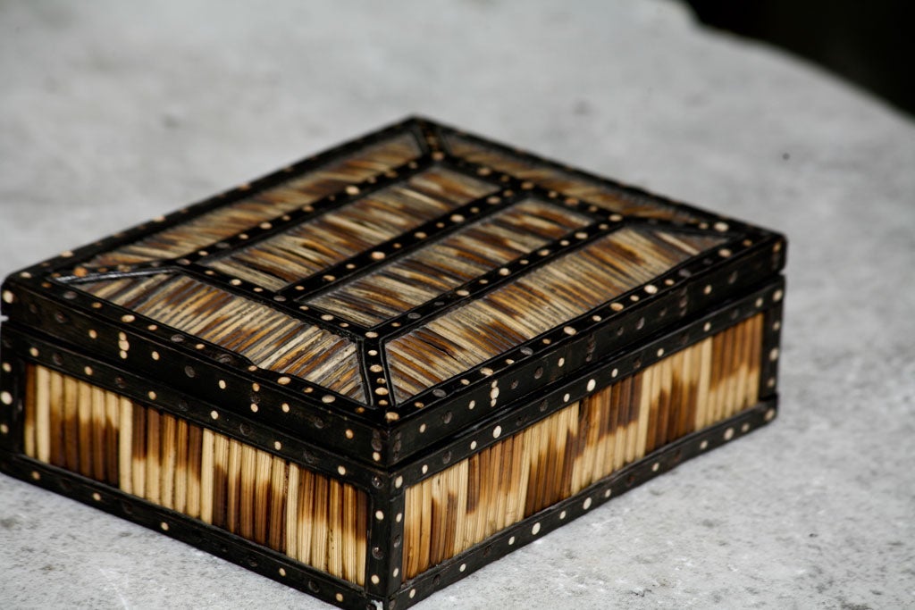 A rectangular Anglo-Indian Porcupine Quill box, inlaid with mother-of-pearl decoration, inside and on the edges of the box.