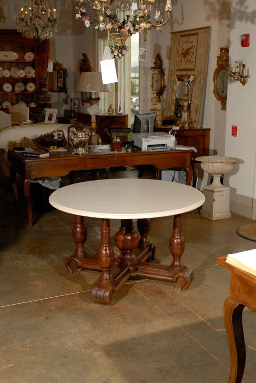 17th century Louis XIII walnut center table with crema Marfil beige marble top.