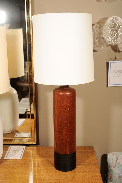 Cylindrical table lamp by ESA. Denmark circa 1960.<br />
<br />
Lamp features a cylindrical teak form inset with metal circles, complemented by a black-leather wrapped base. <br />
<br />
Total height with custom drum paper lampshade is 29”