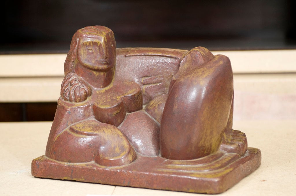 Ceramic figure of a reclining female figure, highly stylized organic form, reminiscent of Henry Moore.