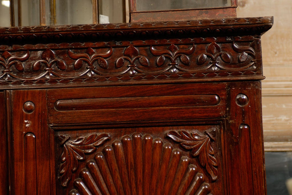 A 19th Century British Colonial Cabinet with Oval Patterns 1