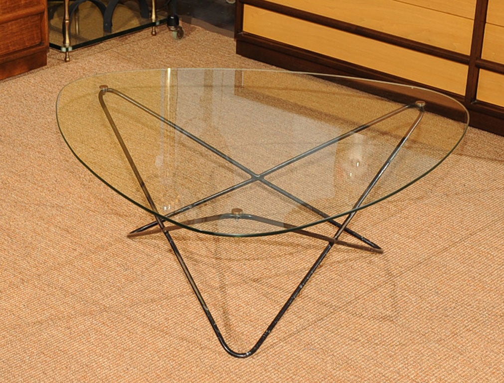 Rare Pierre Guariche atomic designed coffee table, patinated metal and original glass top with brass fittings. Net $2800.00
