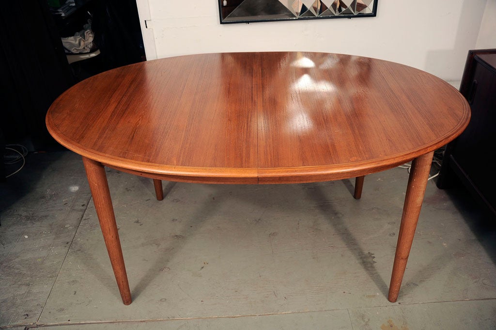 Scandinavian Modern Danish Teak Dining Table with Extensions by Neils Otto Moller For Sale