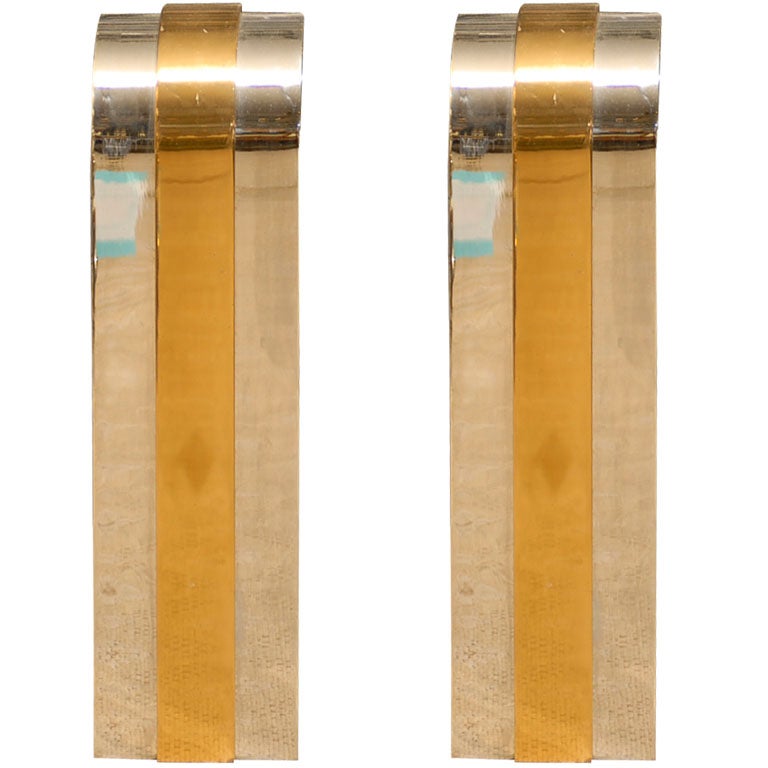 PAIR OF CHROME AND BRASS ANDIRONS IN THE STYLE OF KARL SPRINGER