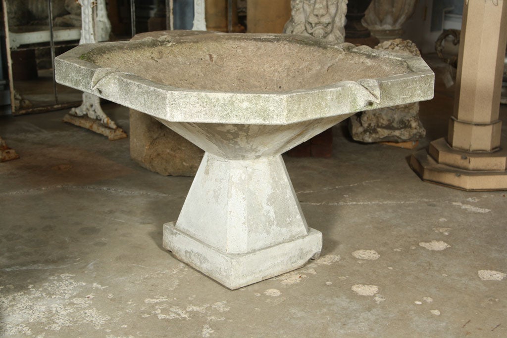 Exceptional Art Deco cast stone fountain in two parts with traces of old white paint.  Sufficiently deep to hold a recirculating pump, this fountain can be self-contained or elevated to a central position in a surrounding pool.  Incredibly beautiful