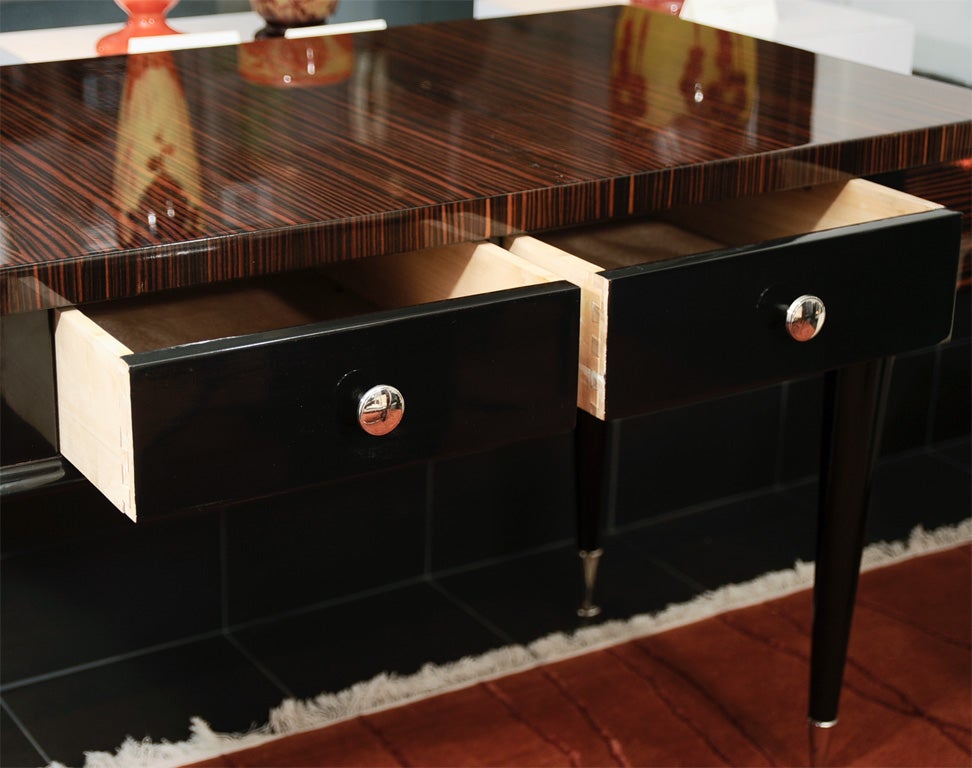 French Art Deco desk in macassar ebony with two center drawers.