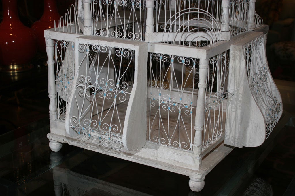 A Spanish Painted and Carved Birdcage 1