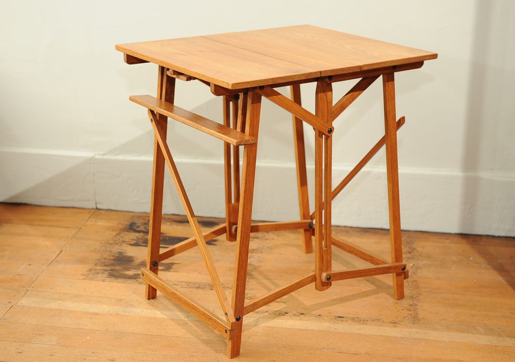 A solid teak folding easel book stand table after a 19th century original