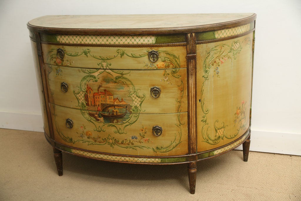 ALL WOOD CONSTRUCTION WITH HAND PAINTED ITALIAN SCENES.CENTER SECTION HAS 3 PULL OUT DRAWERS,THE SIDES HAVE LARGE CURVED DOORS WITH KEY WHICH HAS ADDITIONAL STORAGE.PIECES HAS BEAUTIFUL PATINA.ONCE KEY FOR BOTH DOORS.ALL ORIGINAL CONDITION INCLUDING