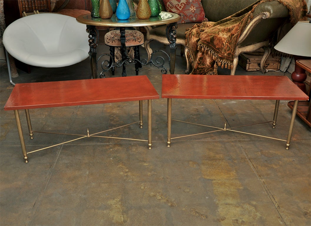 Pair of brass accent tables attributed to Bagues with later laquered linen covered tops.