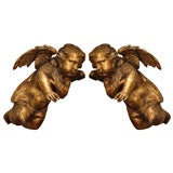 17th CENTURY CARVED AND GILT PUTTI