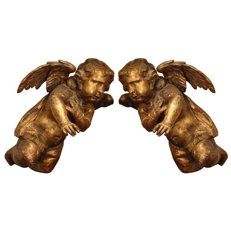 17th CENTURY CARVED AND GILT PUTTI