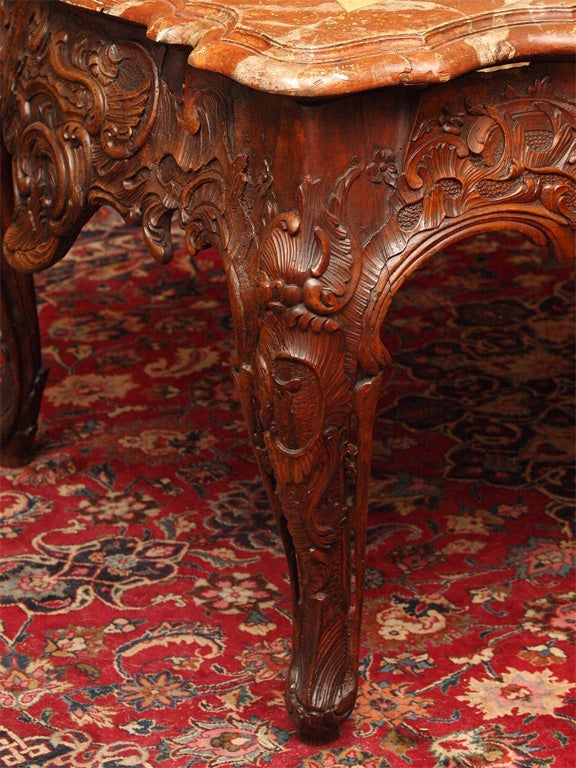 18th century Period Louis XV Walnut Center Table with later faux marble top. The top was added in the 19th century.