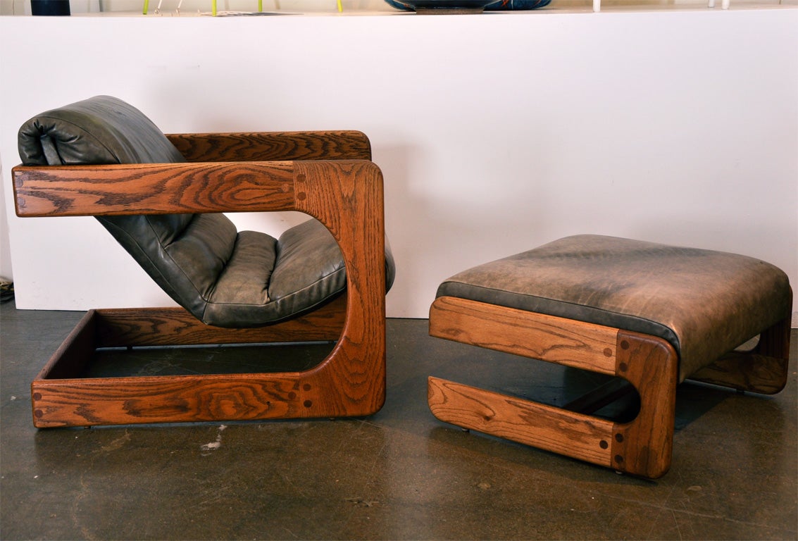 Late 20th Century Oak and upholstered chair and ottoman by Lou Hodges