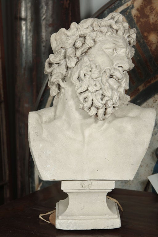 Cast plaster bust of Zeus on a pedestal base