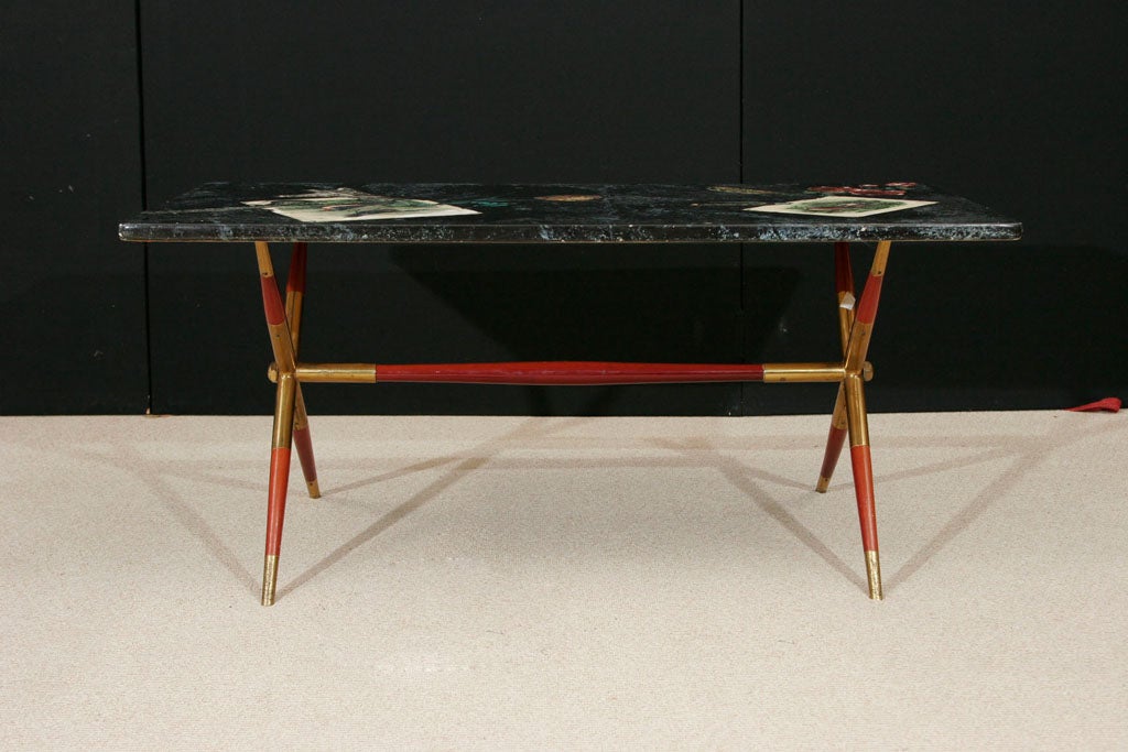 Fornasetti Coffee table with  laquer and brass base by Gio Ponti
