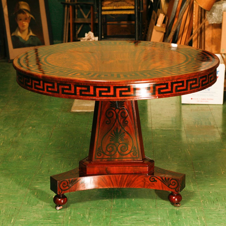 This fine classical table decorated in paint with pelmets, greek key and anthenium relates to the work of Thomas Hope and his pattern books for the decoration of furniture. Done in highly figured wood and then decorated in the latest fashion of the