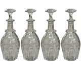 A set of four Cut Crystal Decanters