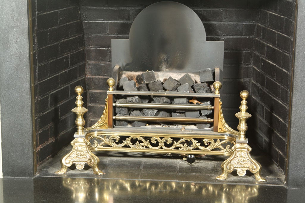 ABSOLUTELY UNIQUE FIREPLACE FENDER, ANDIRONS COAL BASKET (BURNING PIT) WITH FIREBACK AS ONE UNIT...HAND CHASED BRASS IN FRONT AREA...IRON BOX..ONE OF MOST UNIQUE PIECES WE HAVE EVER SEEN.