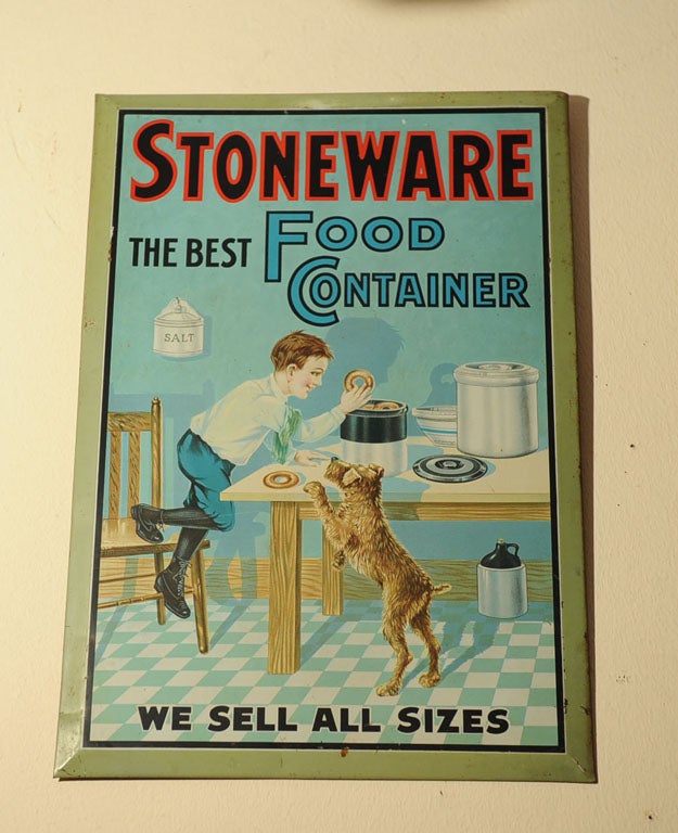 This beautiful tin over cardboard sign has all the great elements to make it a very desirable collectible.  Great color and a wonderful story to be told.  The little boy reaching up to get a goody out of the 
