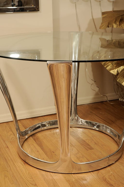 Aluminum pedestal table with round glass top by Boris Tabakoff