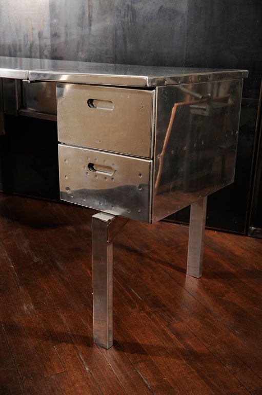 You are looking at a WWII Campaign desk that would have been used in the European and Pacific theater during the war. The desk is made from the same aluminum that was used for aircraft in the 1930s-1940s. The green paint that you see in the drawers