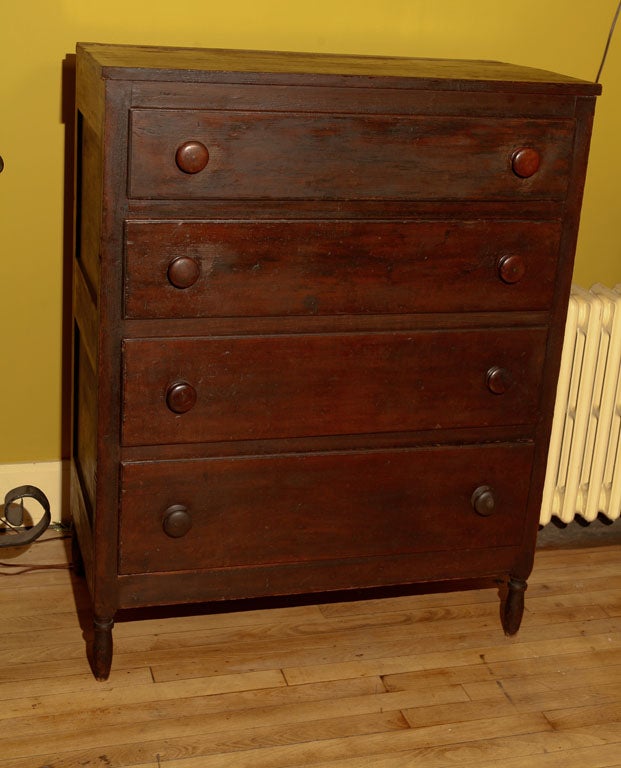 American country Sheraton chest. Possibly made by the Shakers.  Simple, strong lines, with very fine craftmanship.  American northern pine, with old red varnish finish.  Four graduated drawers, with tight dovetailing, on tapered ovoid legs, with