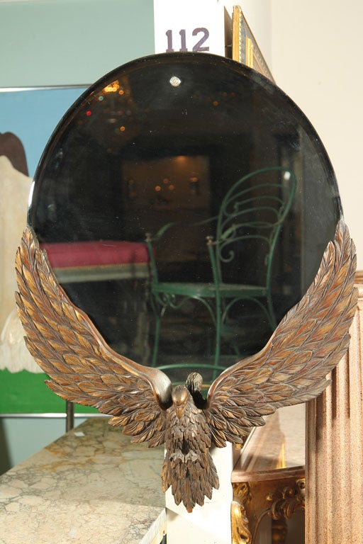 Unusual 19th century carved eagle with mirror mounted on it open wings. Possibly Horner Brothers. Wonderfully detailed.