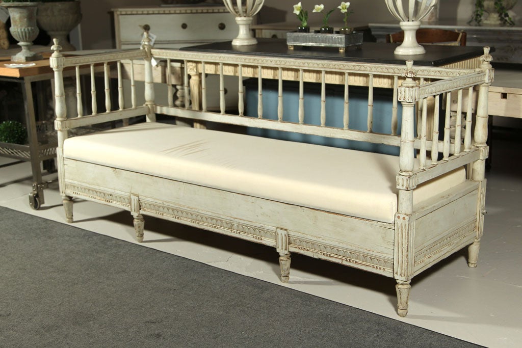 Gorgeous Swedish daybed, overall polychromed in the style of Gustavian, later seat cushion over original storage space.