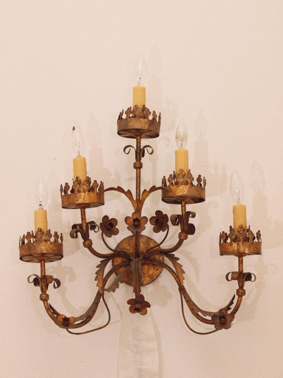 Very unique, 5 arm/light tole sconce in gilded metal.  Completely rewired to meet U.S. code and fitted with beeswax candle sleeves.  Beautiful ironwork.