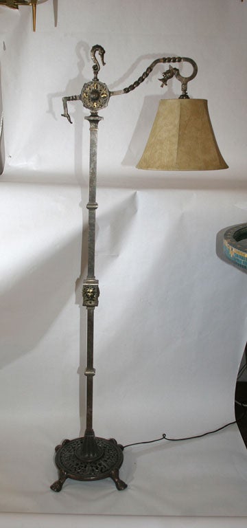An Oscar B Bach patinated iron and brass Floor Lamp
