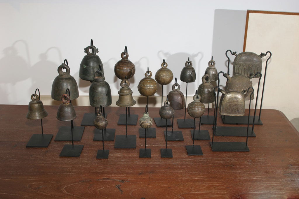 A selection of bronze bells, on stands. Shapes, sizes and prices vary.  Distinct, highly unique and decorative, from Thailand. Sold separately. Largest size shown below