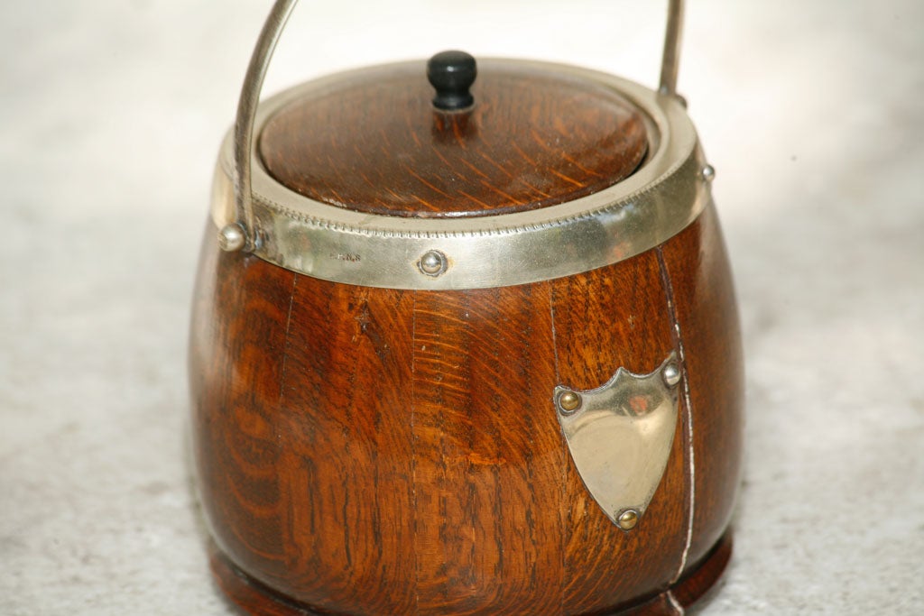 Oak A English oak and silver-plate biscuit  barrel