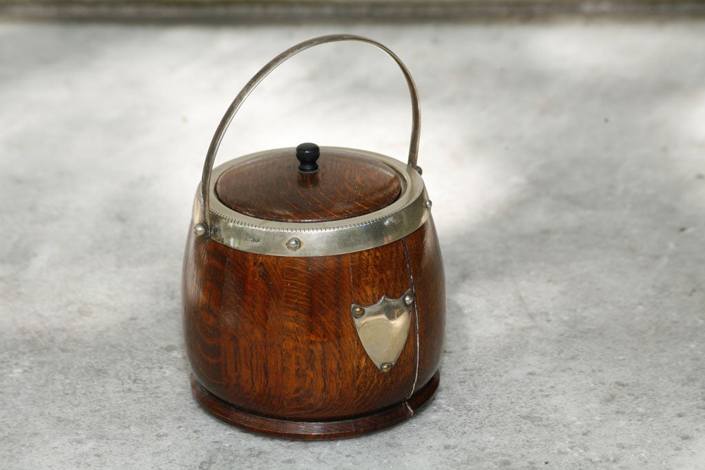 A English oak and silver-plate biscuit  barrel 1