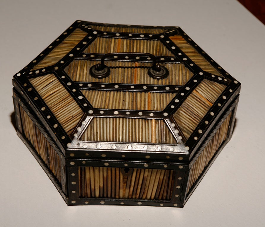 Ebony and ivory inlay hexagonal domed porcupine quill box, with metal handle.   Elephant and 