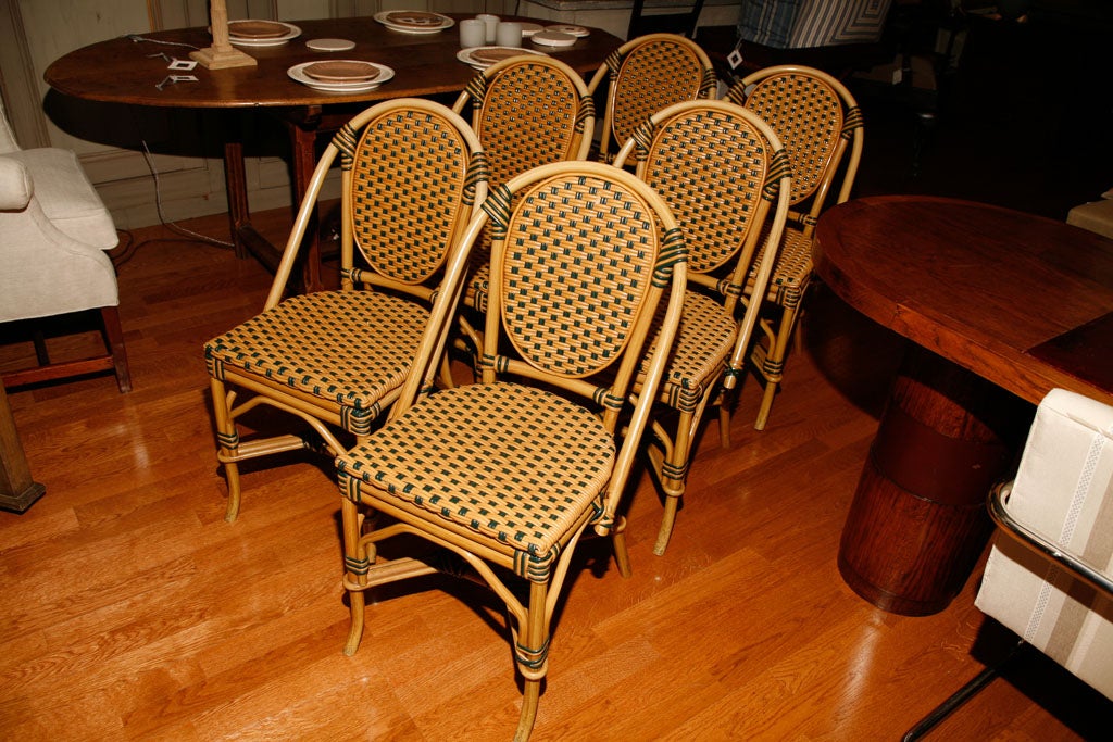 French bistro style faux rattan chairs.
