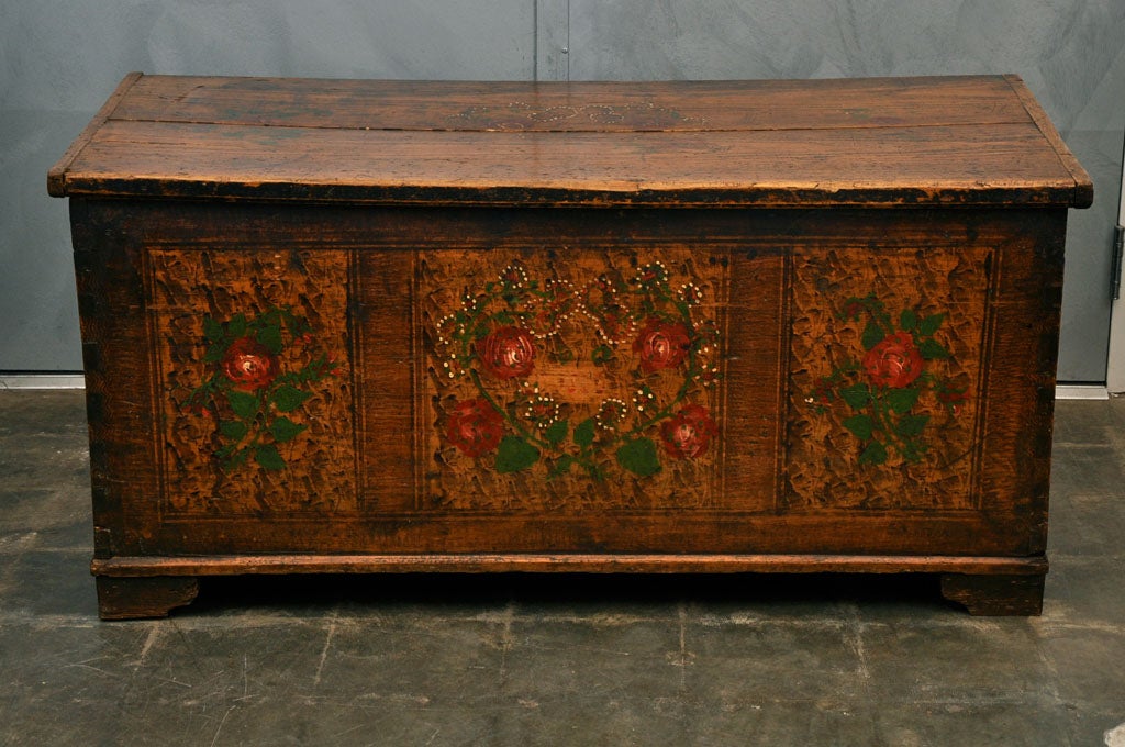 A largish 19th century pine chest having hand painted floral and grain decorative elements. Thought to be French, it is much in tune with the American Pennsylvanian character and feeling. Jefferson West Antiques offer a large selection of antique