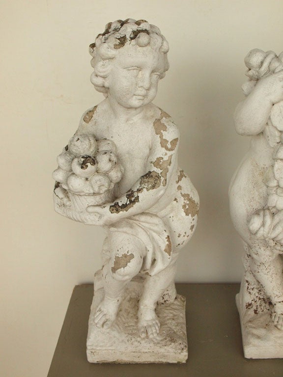 A set of c1940 cherubs representing the four seasons. Each in good condition and showing nice weathering. Dimensions provided below are for cherubs.  Bottom portion (bases) measure 7.5