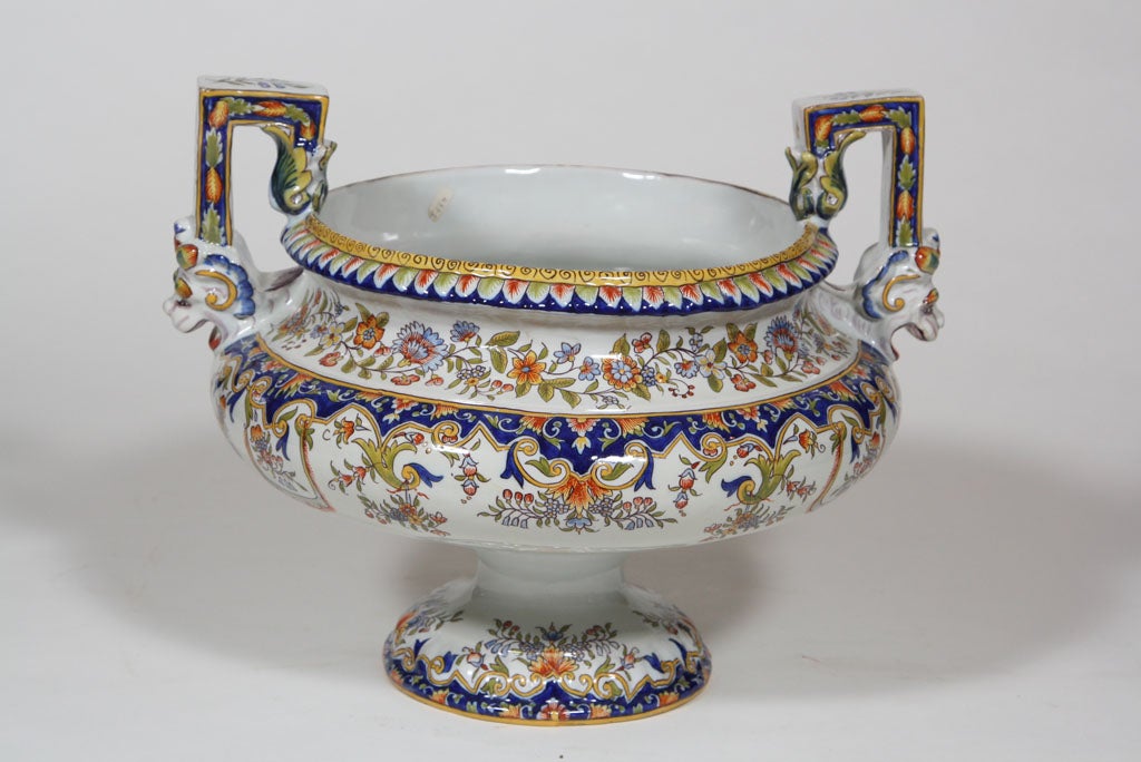 large French faience vasi-shaped footed bowl   with angular shaped arms finishing with roaring lion masks, from the 'Desvre' factory with the correct markings , northern France 1860ca