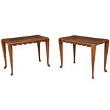 A pair of walnut and rosewood tabourets by Paolo Buffa