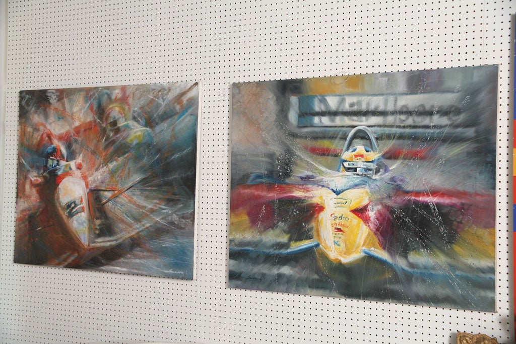 A pair of Brazilian painter Solaris famous Formula 1 paintings.