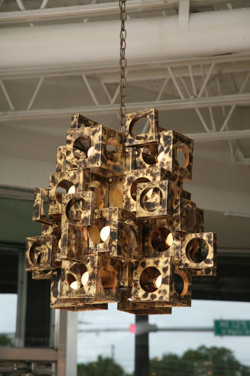 This large-scale cubist chandelier by Tom Greene for Feldman Lighting has a wonderful faux tortoise shell finish applied to the brass.