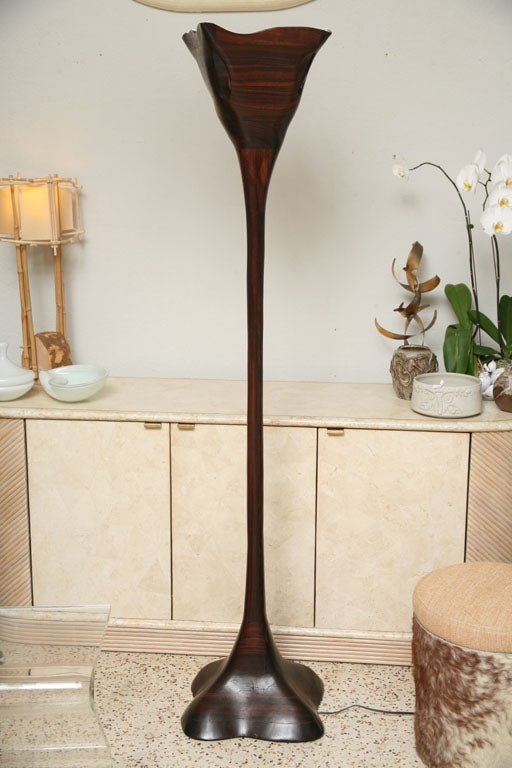 First-rate materials and master craftsmanship combine to create this gorgeous solid rosewood stacked laminate floor lamp, circa 1970. From the Philadelphia area, this wonderful example of the modern American studio-furniture movement has an organic