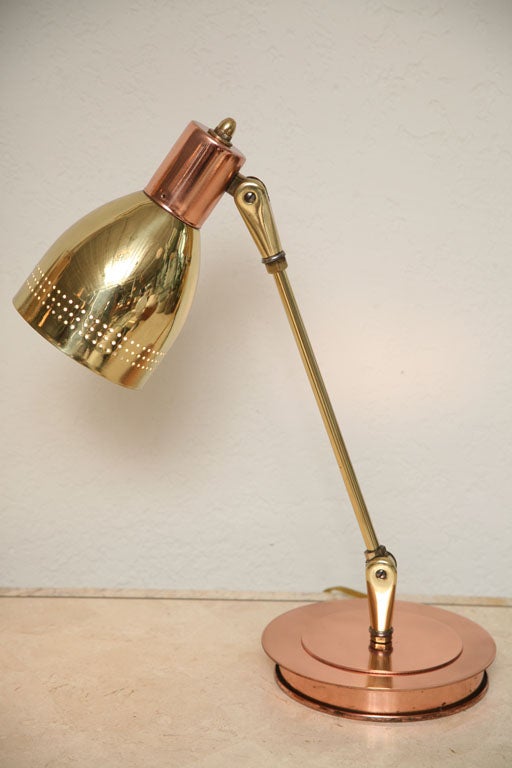This diminutive 50's desk lamp is such a brass and copper charmer, we don't even care that it swivels, angles, and lights (but it does)...