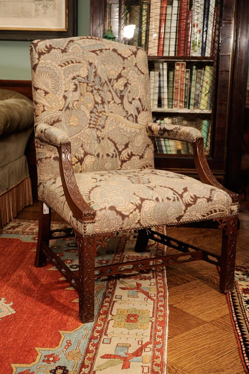 A Pair of English Carved Mahogany Library Armchairs