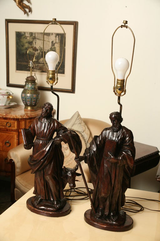 Pair of  French Walnut Statue Converted to lamps