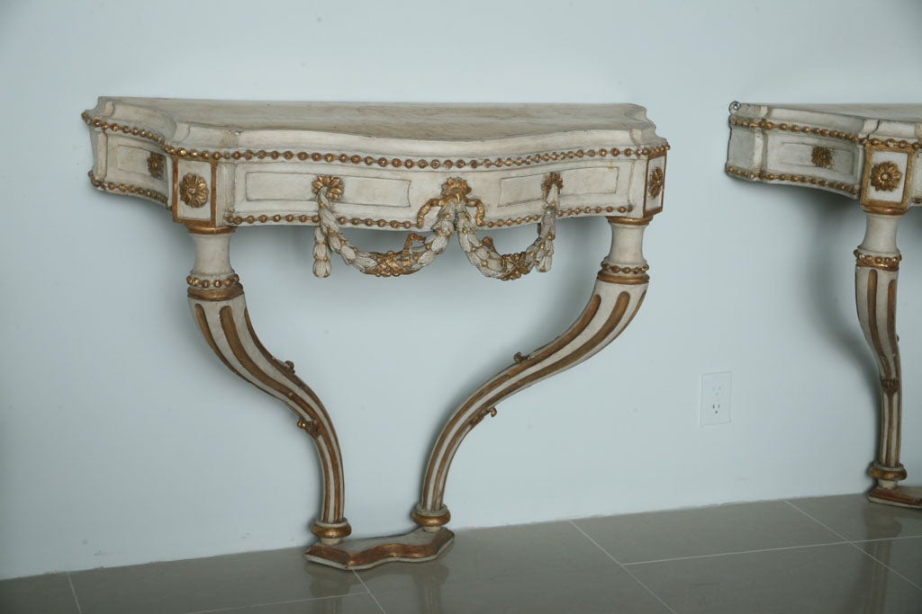 Pair of Italian Neoclassic Cream Painted, Parcel-Gilt Consoles In Excellent Condition For Sale In Hollywood, FL