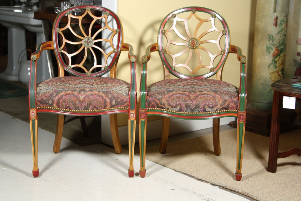 Offered here is a pair of Adams Style painted 'spider back' arm chairs with beautiful paint decoration and complimentary fabric.