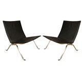Pair of Poul Kjaerholm black leather PK 22 lounge chairs