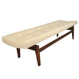 Walnut and leather Jens Risom button tufted cream leather bench